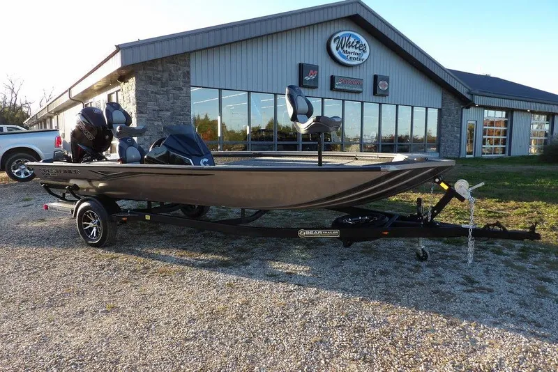The Image of 2026 Crestliner XFC 189 boat on trailer outside marine center. - 0