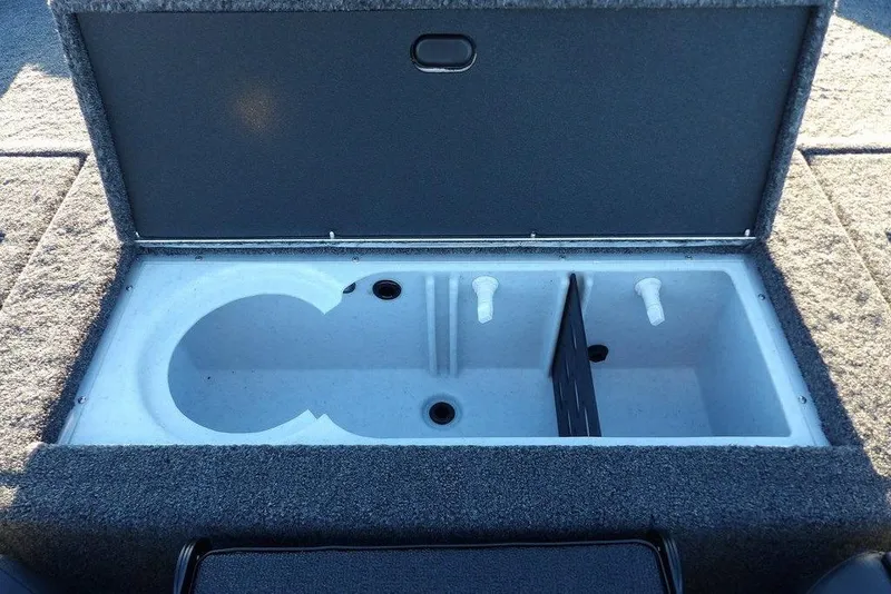 Slide: The Image of 2026 Crestliner XFC 189 boat storage compartment with open lid, showcasing interior design. - 11
