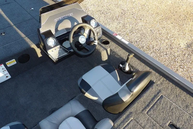 Slide: The Image of 2026 Crestliner XFC 189 boat interior with steering wheel and seating. - 16