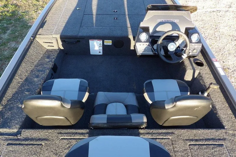 Slide: The Image of 2026 Crestliner XFC 189 boat interior with steering console and seating arrangement. - 17