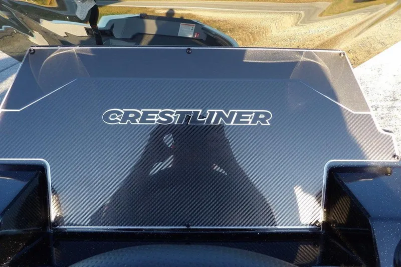 Slide: The Image of 2026 Crestliner XFC 189 dashboard with carbon fiber finish and logo. - 19