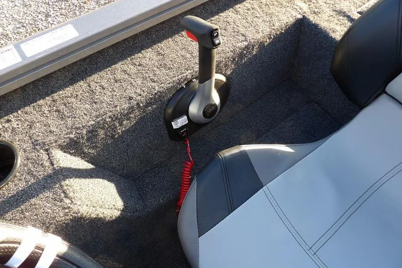 Slide: The Image of 2026 Crestliner XFC 189 boat interior with throttle control and cushioned seat. - 22