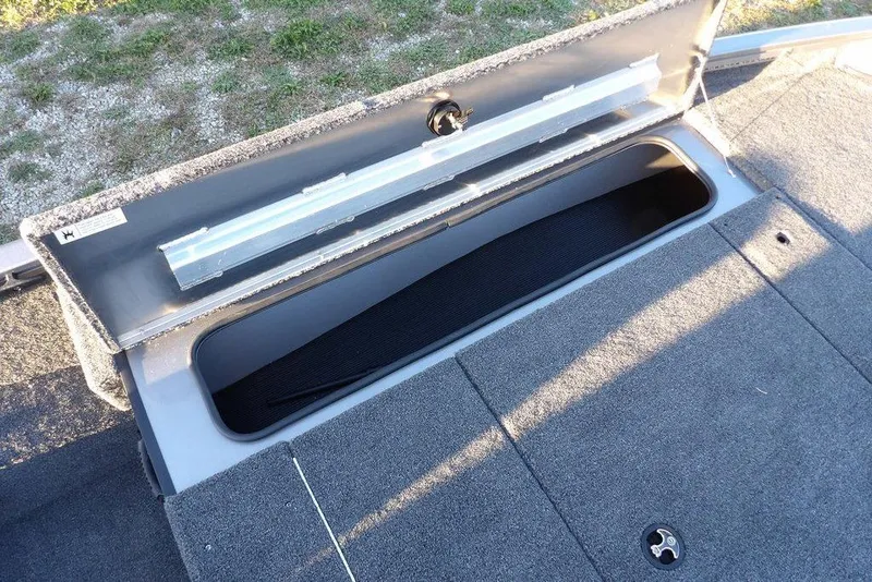 Slide: The Image of Open storage compartment in Crestliner XFC 189 boat, year 2026. - 31