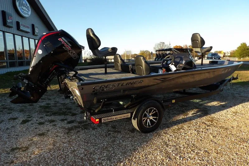 Slide: The Image of 2026 Crestliner XFC 189 fishing boat with powerful outboard motor, parked outdoors. - 4