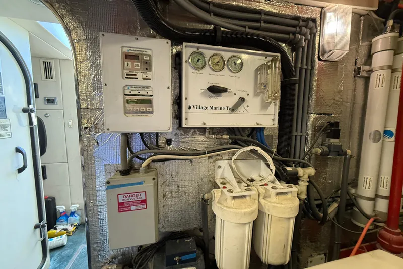 Slide: The Image of Engine room of 2005 Sunseeker 75 Yacht with control panels and filtration system. - 45