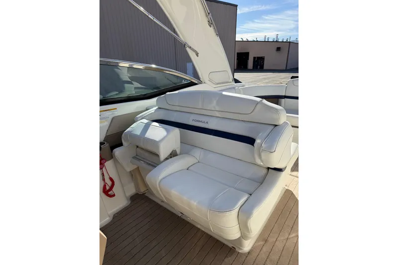 Slide: The Image of 2014 Formula 310 Sun Sport boat interior with white leather seating. - 5