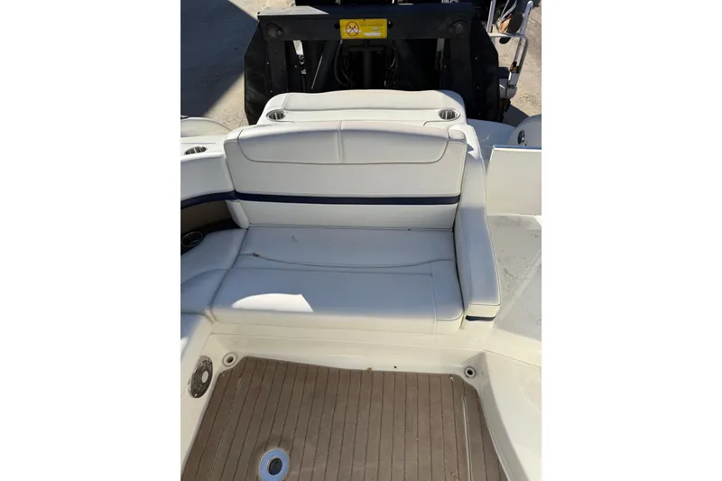 Slide: The Image of 2014 Formula 310 Sun Sport boat interior with white seating and wood flooring. - 8