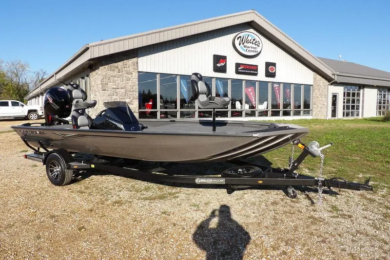 The Image of 2026 Crestliner XFC 189 boat on trailer outside marine center. - 0