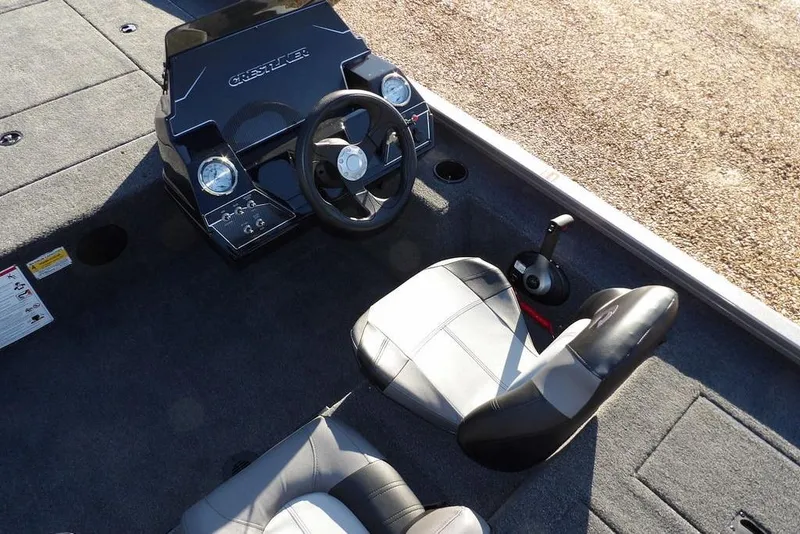 Slide: The Image of 2026 Crestliner XFC 189 boat interior with steering wheel and seating. - 13