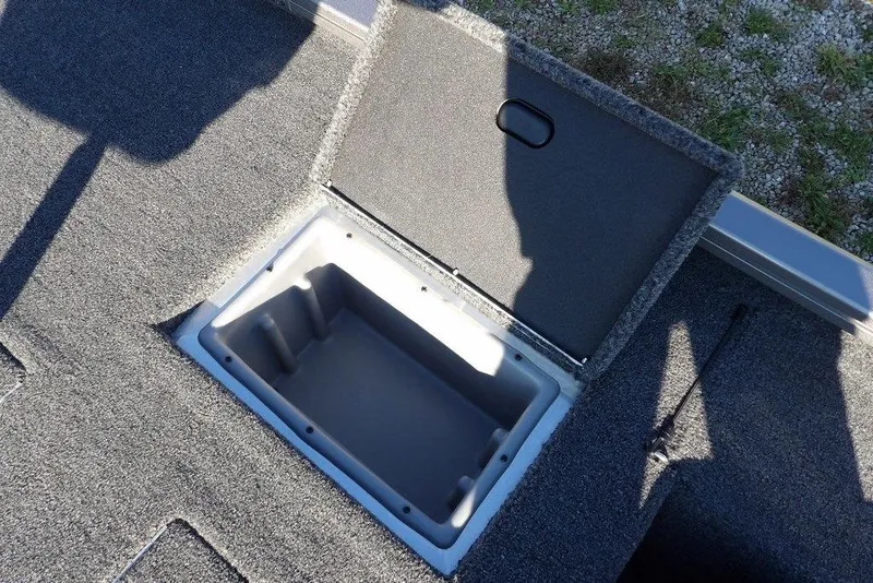 Slide: The Image of Open storage compartment on 2026 Crestliner XFC 189 boat deck. - 14