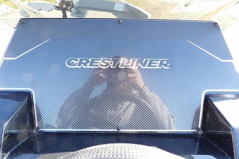 Slide: The Image of 2026 Crestliner XFC 189 dashboard with carbon fiber finish and logo. - 18