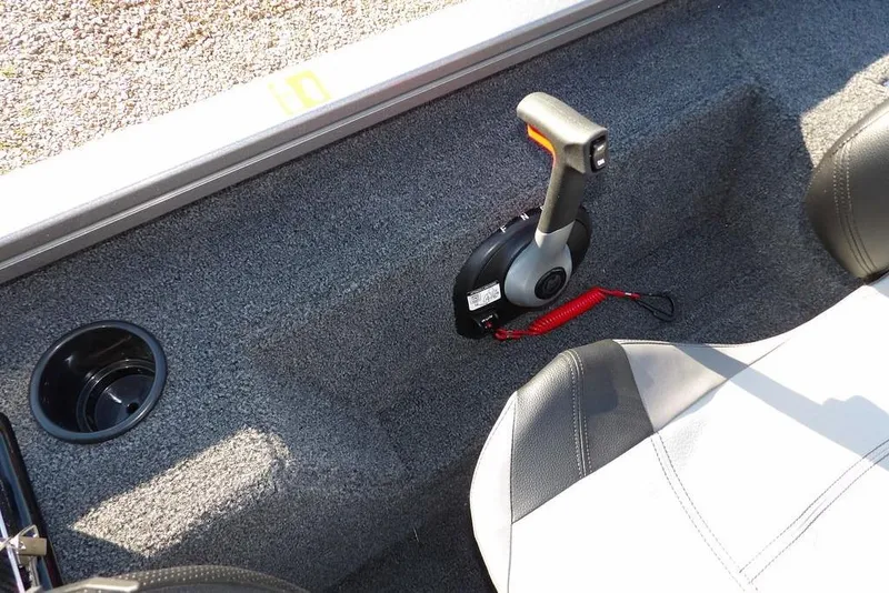 Slide: The Image of Interior of 2026 Crestliner XFC 189 boat with throttle control and cup holder. - 19