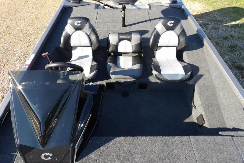 Slide: The Image of 2026 Crestliner XFC 189 boat interior with three seats and steering console. - 21