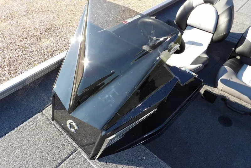 Slide: The Image of 2026 Crestliner XFC 189 boat console with sleek black design and comfortable seating. - 24