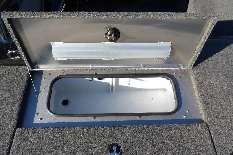 Slide: The Image of Open storage compartment on 2026 Crestliner XFC 189 boat deck. - 27
