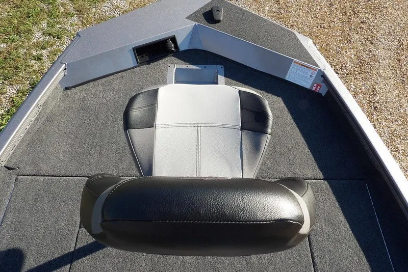 Slide: The Image of 2026 Crestliner XFC 189 boat interior with cushioned seat and carpeted deck. - 30