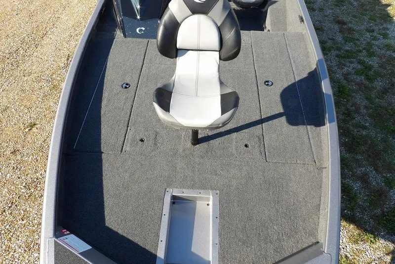 Slide: The Image of 2026 Crestliner XFC 189 boat interior with gray carpet and swivel seat. - 35