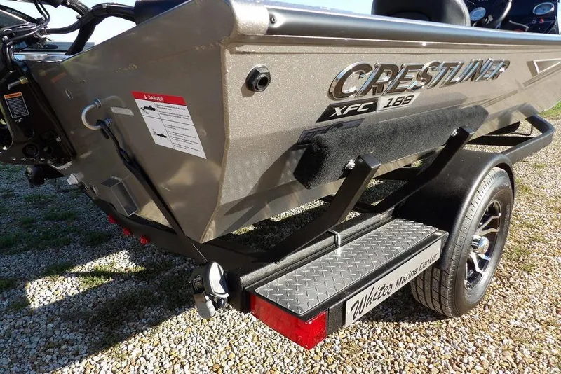 Slide: The Image of 2026 Crestliner XFC 189 boat on trailer, rear view, parked on gravel. - 38