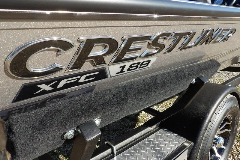 Slide: The Image of 2026 Crestliner XFC 189 boat logo on metallic surface, close-up view. - 40