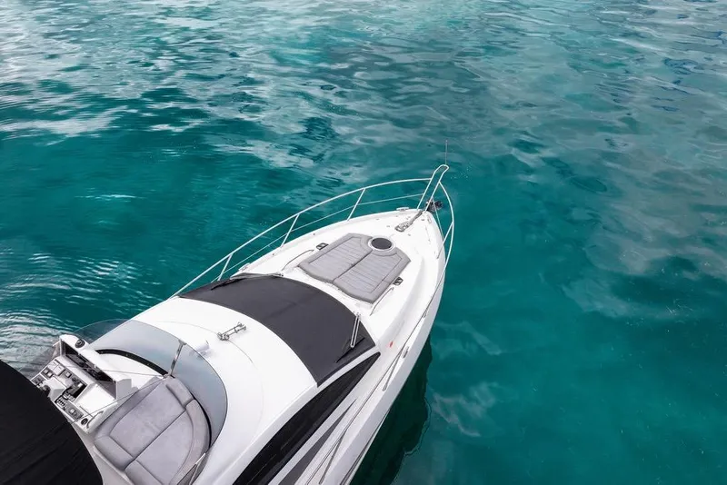 Slide: The Image of Sunseeker Manhattan 55 yacht on clear turquoise water, 2016 model. - 15