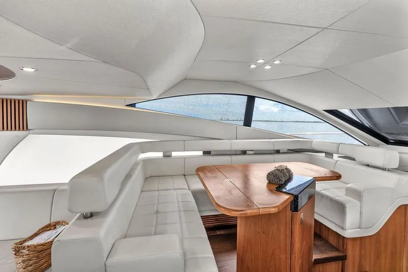 Slide: The Image of Luxurious interior of 2016 Sunseeker Manhattan 55 yacht with elegant seating and wooden table. - 28