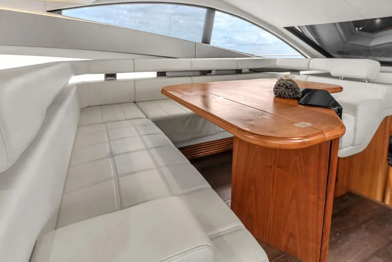 Slide: The Image of Luxurious interior of 2016 Sunseeker Manhattan 55 yacht with elegant seating and wooden table. - 29