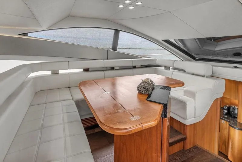Slide: The Image of Luxurious interior of 2016 Sunseeker Manhattan 55 yacht with elegant seating and wooden table. - 30