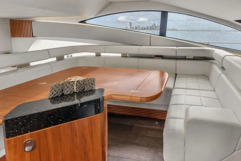 Slide: The Image of Luxurious interior of 2016 Sunseeker Manhattan 55 yacht with elegant seating and wooden table. - 31