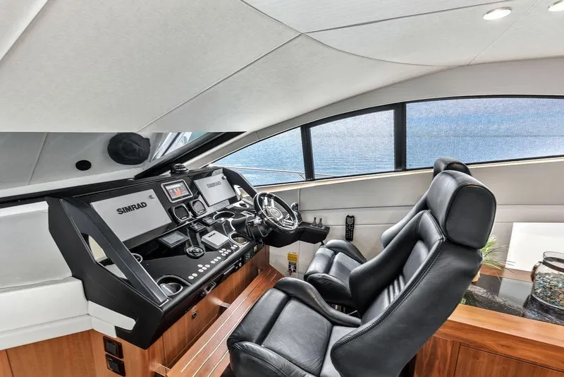 Slide: The Image of Luxurious helm of 2016 Sunseeker Manhattan 55 yacht with Simrad navigation system. - 34