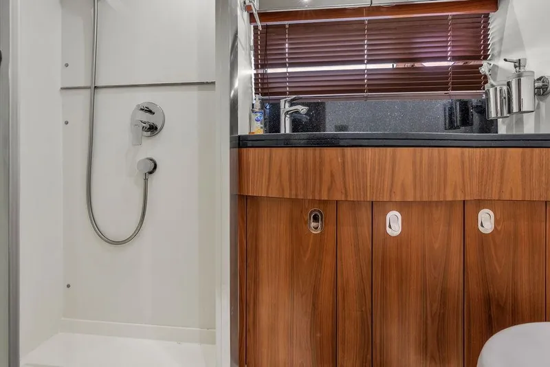 Slide: The Image of Luxurious bathroom interior of 2016 Sunseeker Manhattan 55 yacht with modern shower and wooden cabinetry. - 46