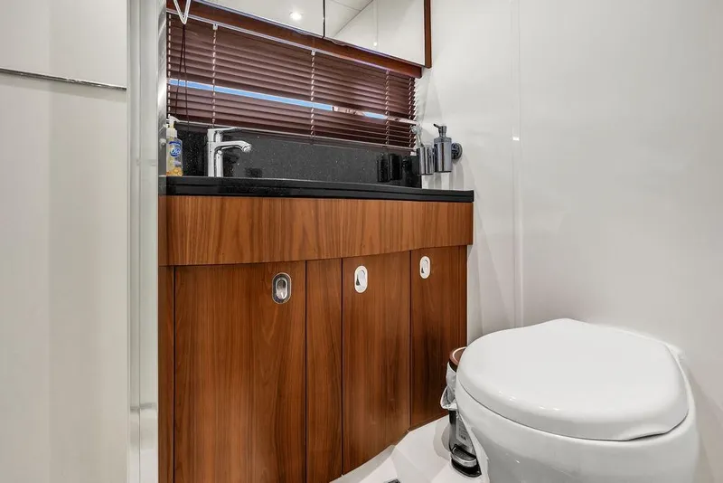 Slide: The Image of Luxurious bathroom in 2016 Sunseeker Manhattan 55 yacht with wooden cabinetry and modern fixtures. - 47