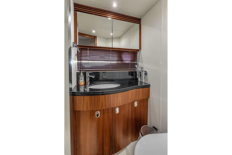 Slide: The Image of Luxurious bathroom in 2016 Sunseeker Manhattan 55 yacht with elegant wood cabinetry. - 50