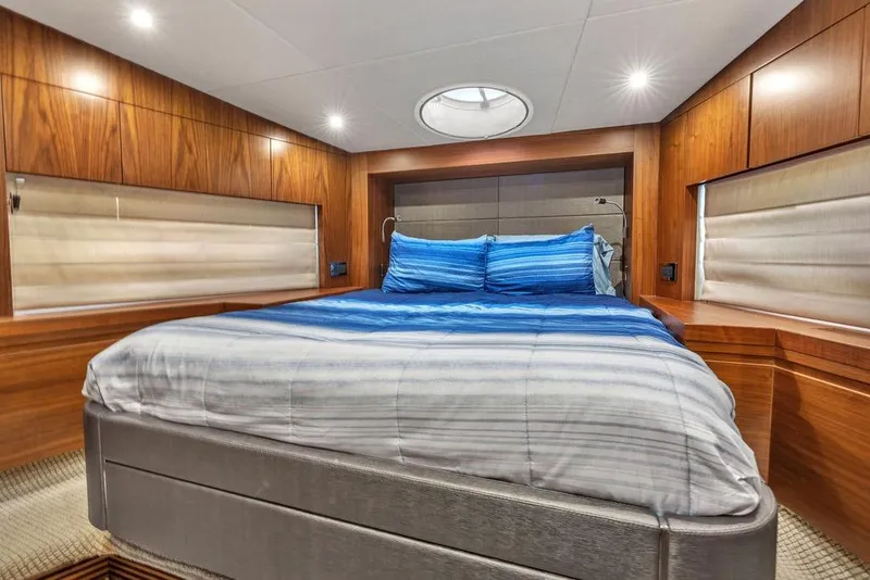 Slide: The Image of Luxurious cabin interior of 2016 Sunseeker Manhattan 55 yacht with wood paneling and cozy bedding. - 51