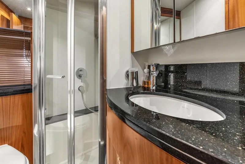 Slide: The Image of Luxurious bathroom in 2016 Sunseeker Manhattan 55 yacht with sleek shower and modern sink. - 54