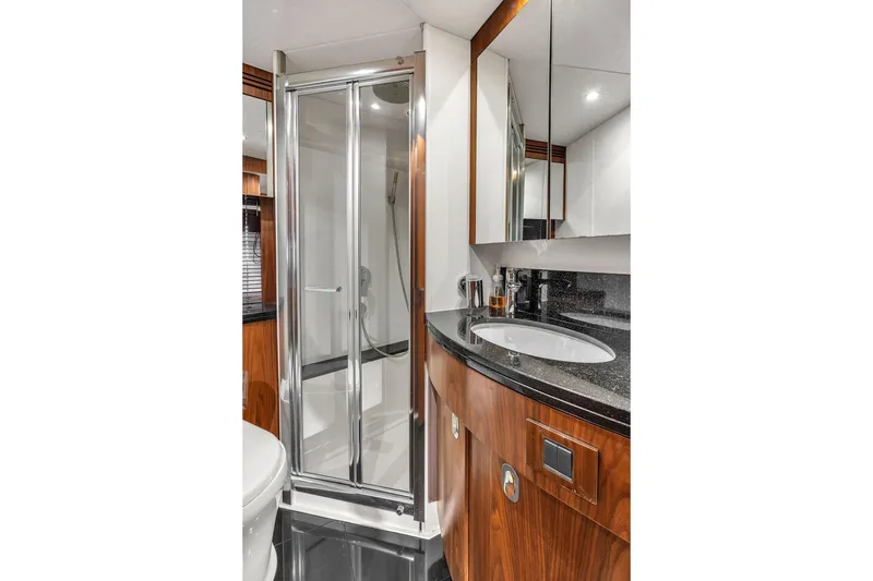 Slide: The Image of Luxurious bathroom in 2016 Sunseeker Manhattan 55 yacht with sleek shower and elegant vanity. - 55