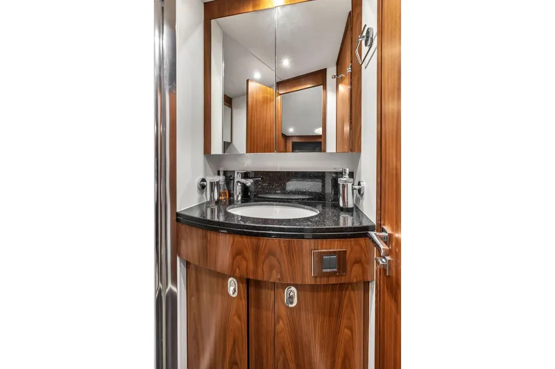 Slide: The Image of Luxurious bathroom in 2016 Sunseeker Manhattan 55 yacht with wood accents and modern fixtures. - 56