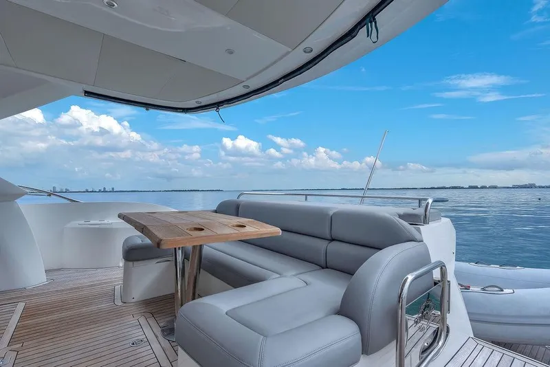 Slide: The Image of Luxurious 2016 Sunseeker Manhattan 55 yacht deck with seating and ocean view. - 61