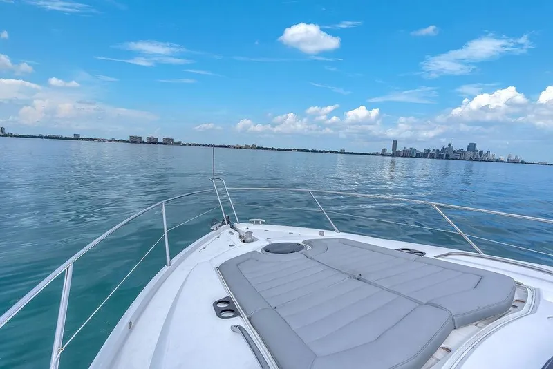 Slide: The Image of Sunseeker Manhattan 55 yacht cruising with city skyline in the background, 2016 model. - 77