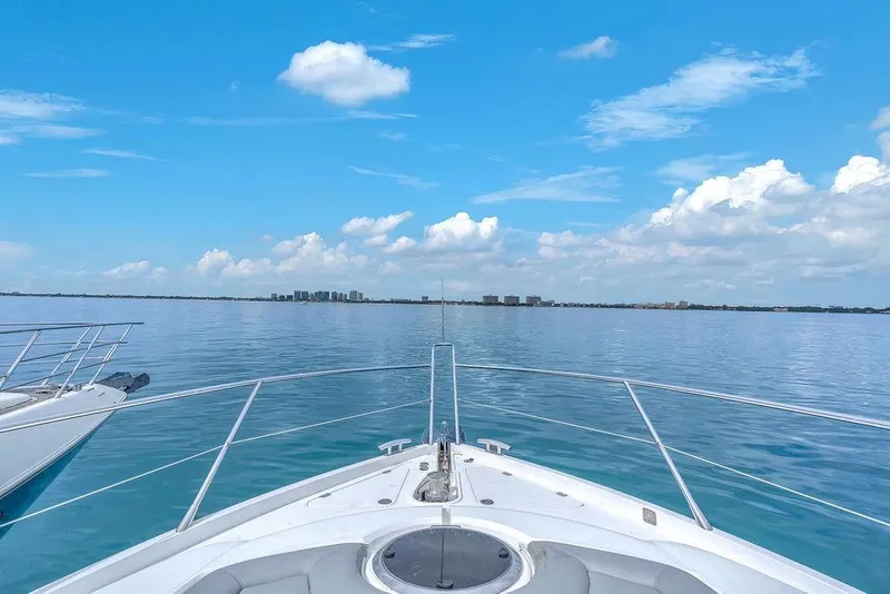 Slide: The Image of Bow view from 2016 Sunseeker Manhattan 55 yacht on calm ocean under blue sky. - 78