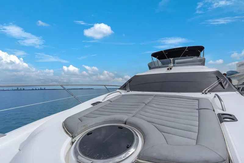 Slide: The Image of Luxury Sunseeker Manhattan 55 yacht, 2016 model, cruising under a clear blue sky. - 79