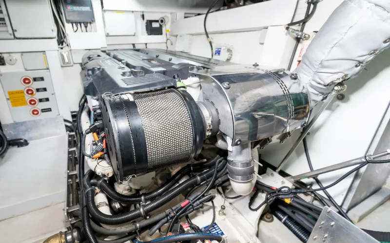 Slide: The Image of Engine room of 2016 Sunseeker Manhattan 55 yacht, showcasing mechanical components and wiring. - 83