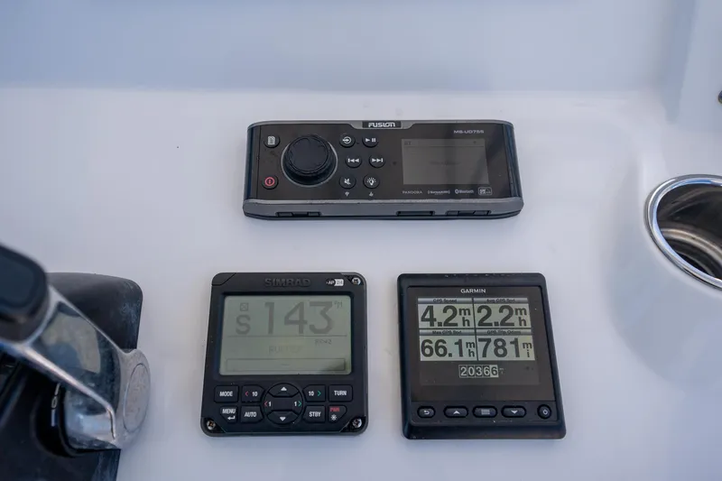 Slide: The Image of Control panel of a 2015 Intrepid 400 Center Console with navigation and audio systems. - 19