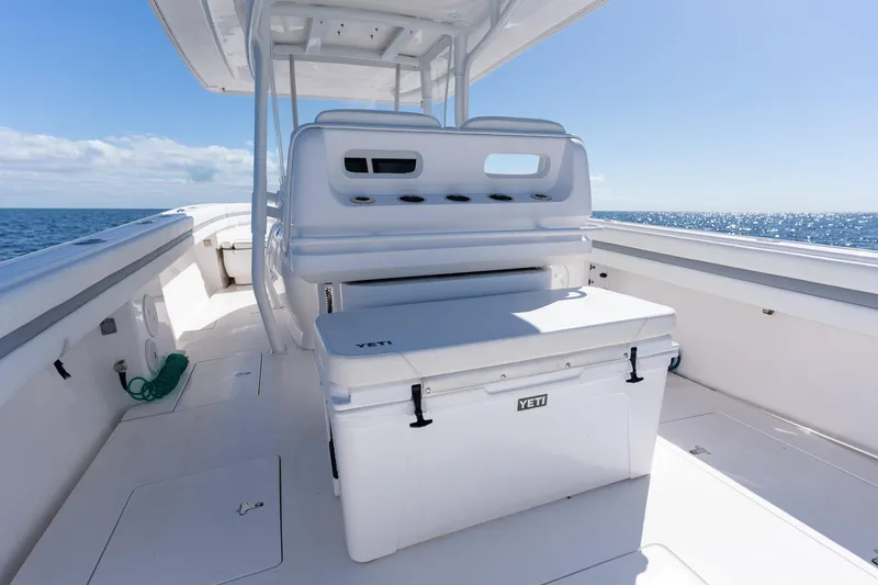 Slide: The Image of 2015 Intrepid 400 Center Console boat interior with Yeti cooler, ocean view. - 21