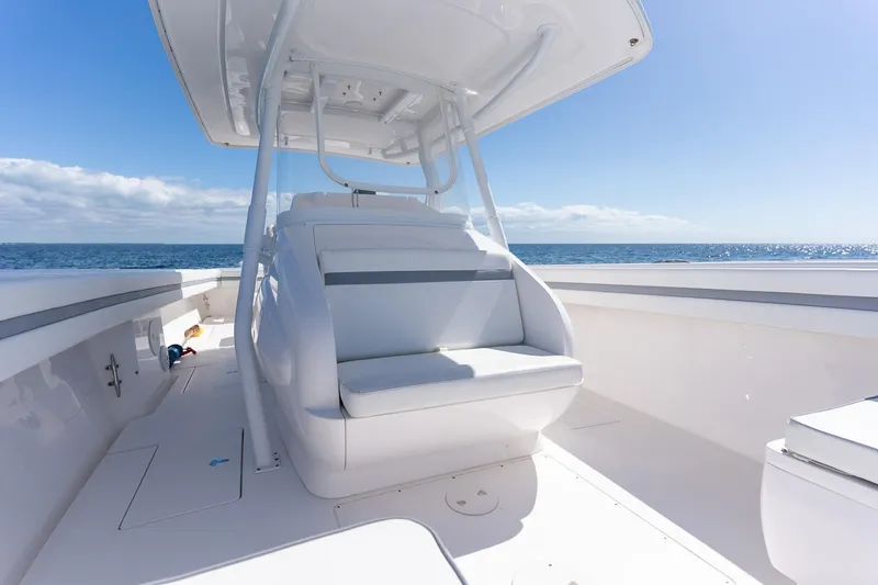 Slide: The Image of 2015 Intrepid 400 Center Console boat on open sea under clear blue sky. - 30