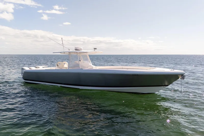 Slide: The Image of 2015 Intrepid 400 Center Console boat on calm ocean waters under clear sky. - 4