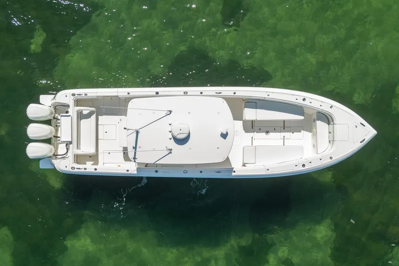 Slide: The Image of Aerial view of 2015 Intrepid 400 Center Console boat on clear green water. - 5