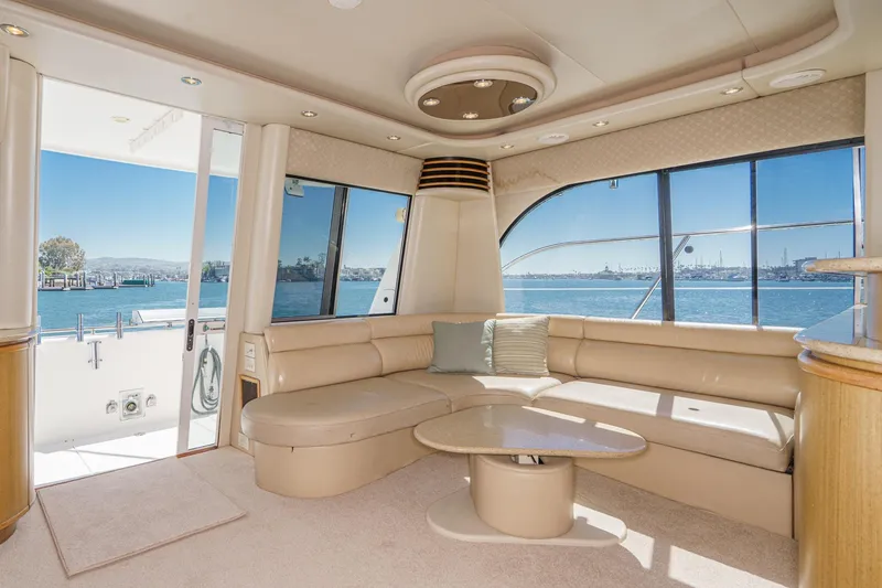 Slide: The Image of Luxurious interior of 2000 Bayliner 5788 Pilot House Motoryacht with waterfront view. - 24