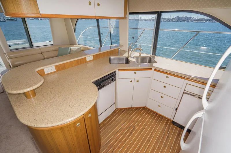 Slide: The Image of Luxurious kitchen interior of 2000 Bayliner 5788 Pilot House Motoryacht with ocean view. - 35