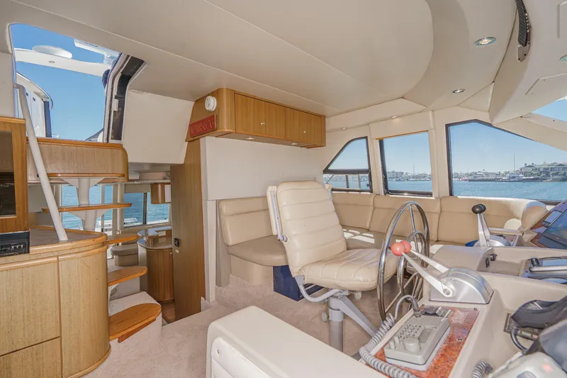 Slide: The Image of Interior of 2000 Bayliner 5788 Pilot House Motoryacht with helm and seating area. - 37