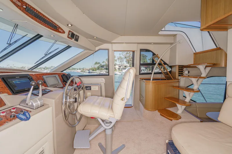 Slide: The Image of Luxurious interior of 2000 Bayliner 5788 Pilot House Motoryacht with helm and staircase. - 40
